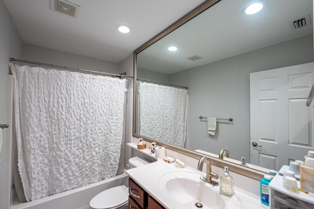 full bathroom featuring toilet, visible vents, and vanity