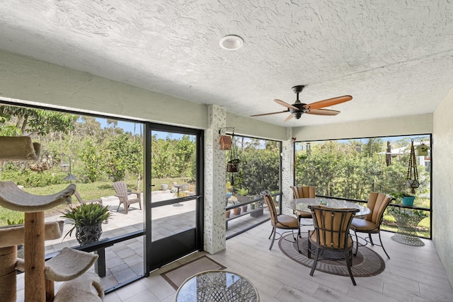 sunroom / solarium with ceiling fan