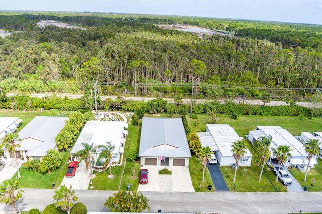 bird's eye view with a residential view and a view of trees