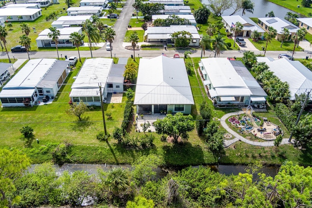 aerial view featuring a water view and a residential view