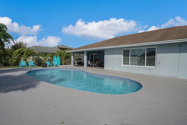 view of pool featuring a patio, fence, and a fenced in pool