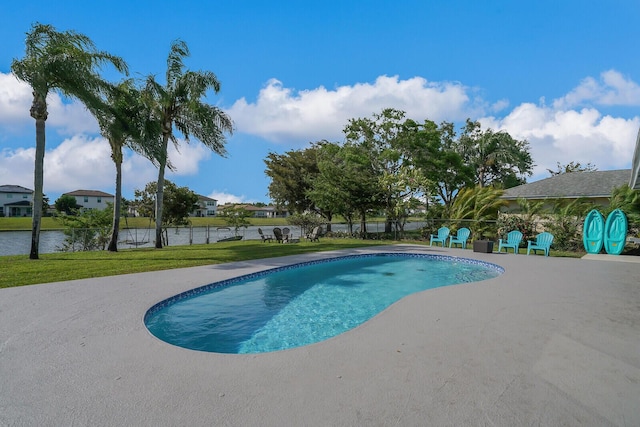 view of pool with a yard, a patio area, a fenced in pool, and fence