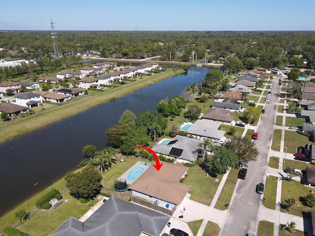 aerial view featuring a residential view and a water view