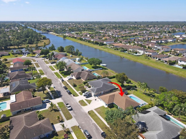 aerial view with a residential view and a water view