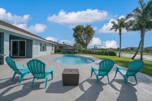 view of pool with a patio and a trampoline