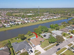 bird's eye view featuring a water view and a residential view