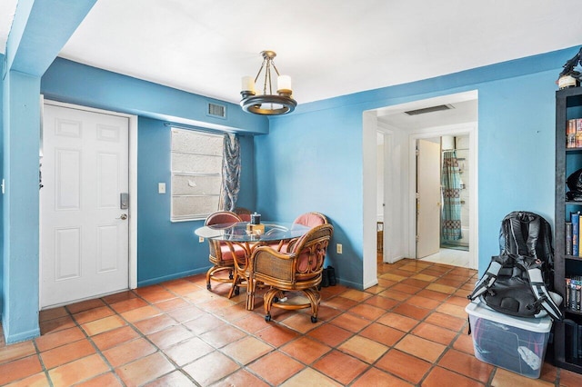 dining room with baseboards, visible vents, and light tile patterned flooring