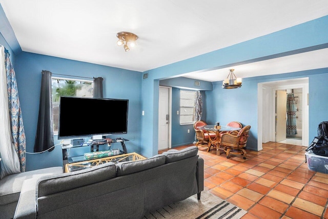 living area featuring a healthy amount of sunlight and light tile patterned flooring