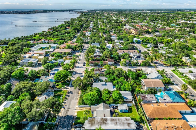 drone / aerial view featuring a water view and a residential view