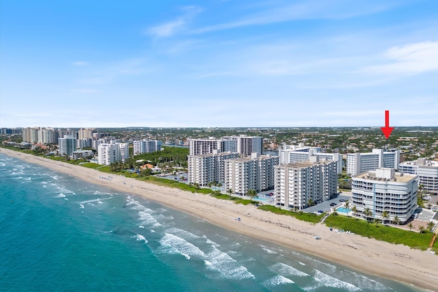 bird's eye view featuring a beach view, a water view, and a city view