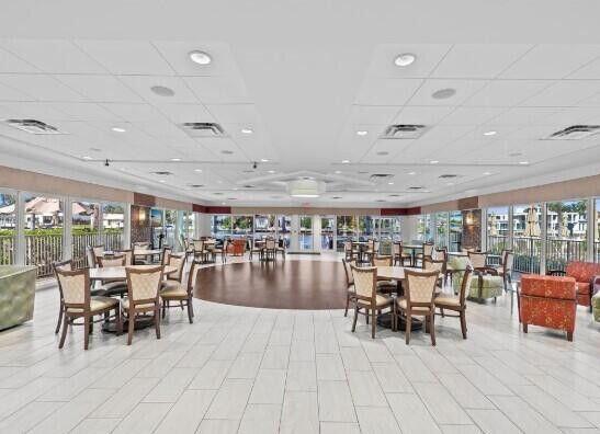 dining area with a paneled ceiling and visible vents