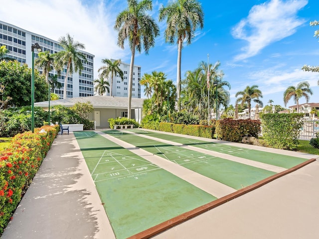 view of home's community featuring shuffleboard