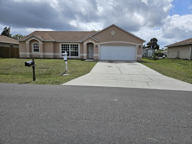 single story home with a front yard, driveway, and stucco siding