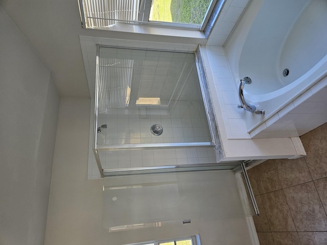 bathroom with a tile shower