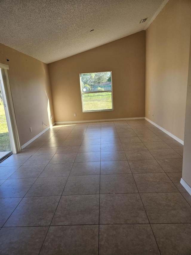 570 Ontario St NW, Palm Bay, FL 32907 - unfurnished room featuring a textured ceiling, tile patterned flooring, and baseboards