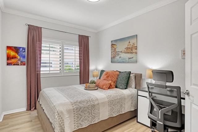 bedroom featuring baseboards, ornamental molding, and wood finished floors