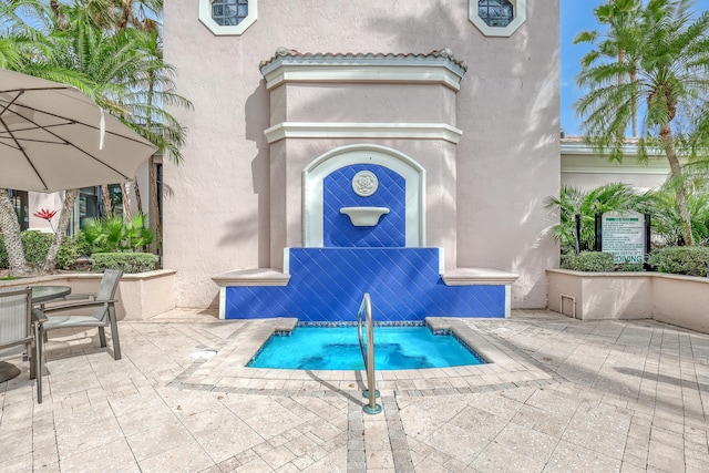 view of swimming pool featuring a patio area