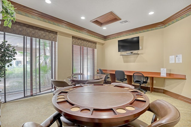 playroom featuring ornamental molding, built in desk, visible vents, and a healthy amount of sunlight