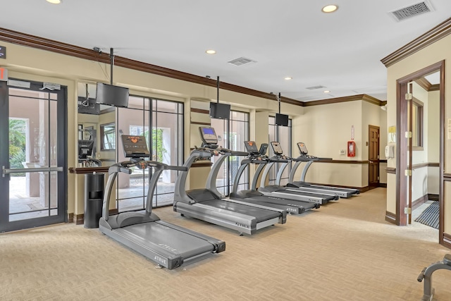 exercise room with baseboards, visible vents, ornamental molding, and recessed lighting