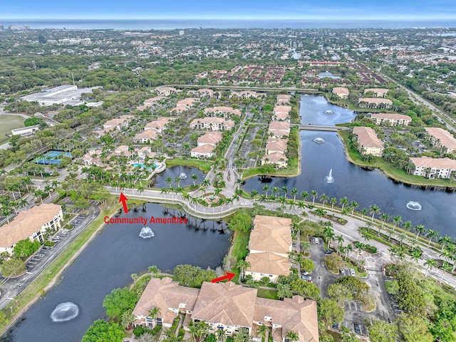 birds eye view of property with a residential view and a water view