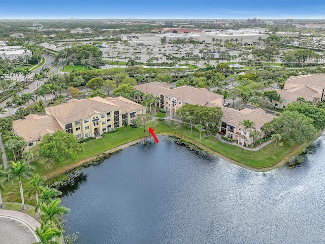 birds eye view of property with a water view and a residential view