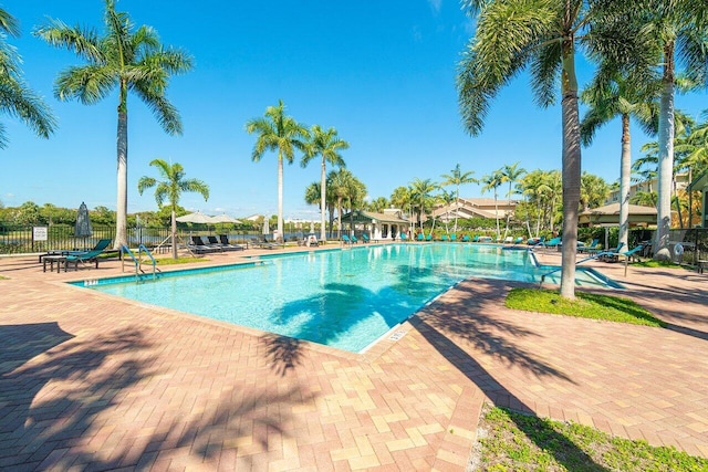 pool featuring a patio area and fence