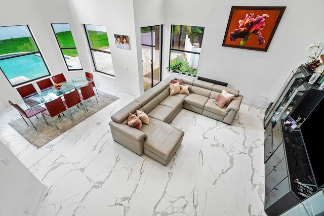 living area with marble finish floor