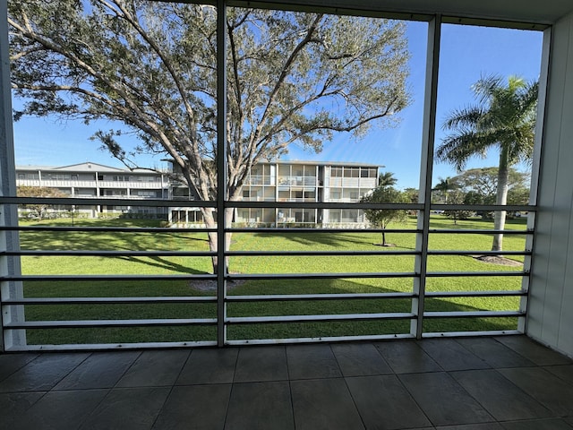 view of gate featuring a lawn