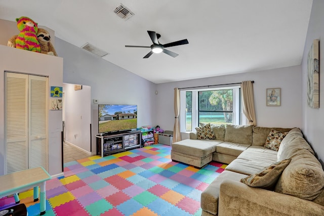 carpeted living room with lofted ceiling, visible vents, and ceiling fan