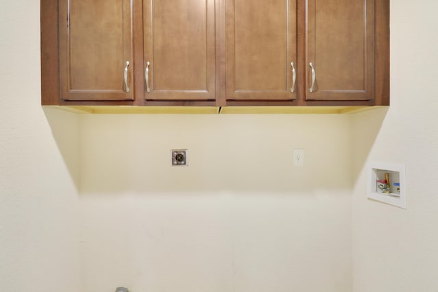 laundry room featuring cabinet space, washer hookup, and electric dryer hookup