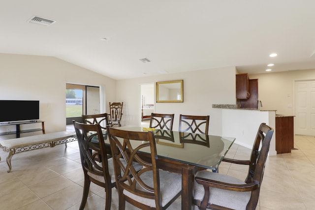 dining room featuring lofted ceiling, light tile patterned flooring, visible vents, and recessed lighting