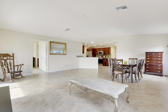 dining area featuring light tile patterned floors, baseboards, visible vents, vaulted ceiling, and recessed lighting