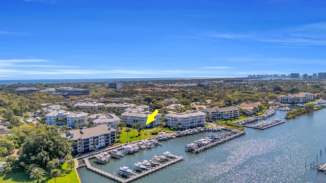 birds eye view of property featuring a view of city and a water view