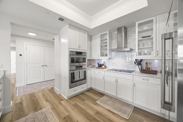 entrance foyer with wine cooler, baseboards, visible vents, and light wood-type flooring