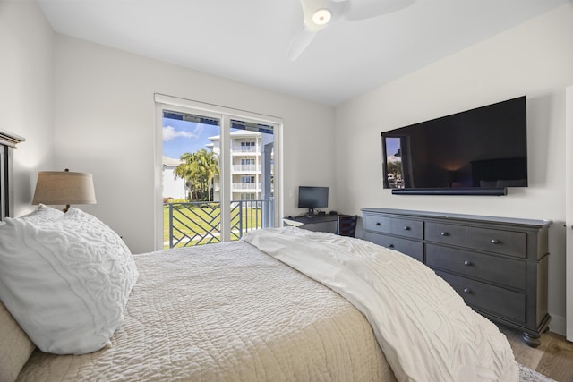 bedroom with access to outside, ceiling fan, and wood finished floors