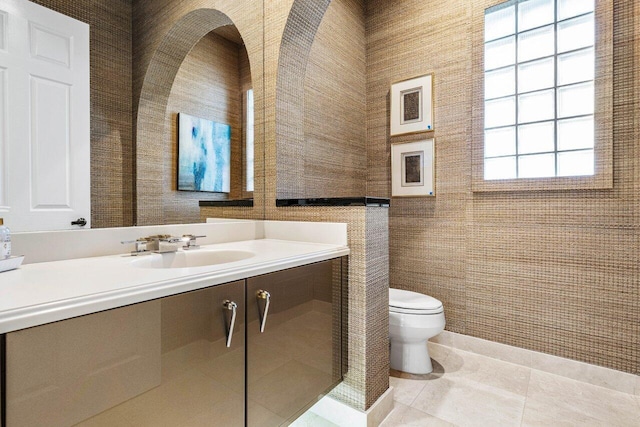 bathroom featuring toilet, vanity, and tile patterned floors