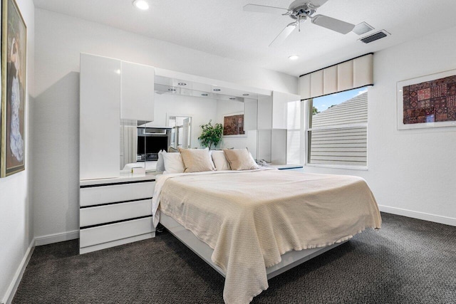 bedroom with recessed lighting, dark carpet, visible vents, and baseboards