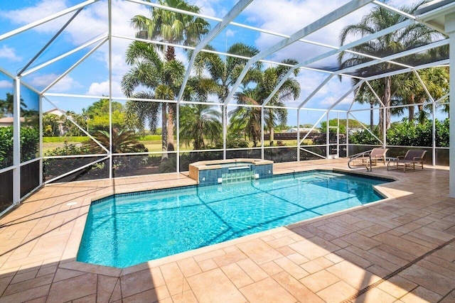 view of swimming pool with a patio area, a lanai, and a pool with connected hot tub