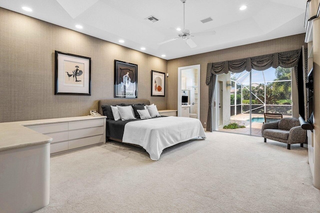 bedroom featuring a tray ceiling, recessed lighting, visible vents, light carpet, and access to outside