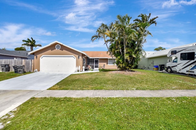 single story home featuring a garage, driveway, fence, and a front yard