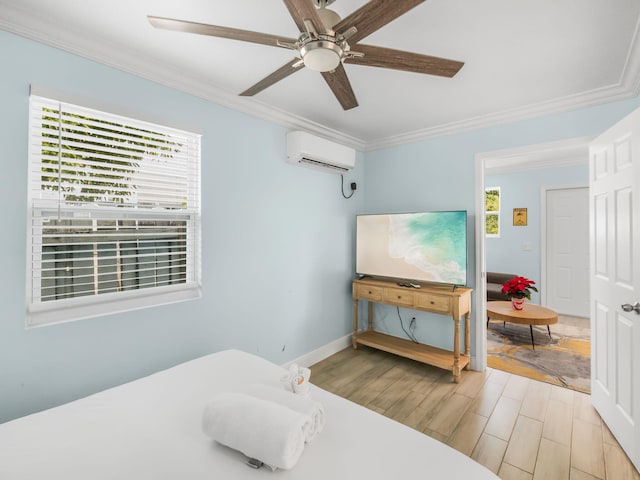 bedroom with baseboards, a ceiling fan, ornamental molding, wood finished floors, and an AC wall unit