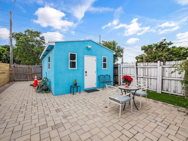 view of outbuilding featuring a fenced backyard and an outdoor structure