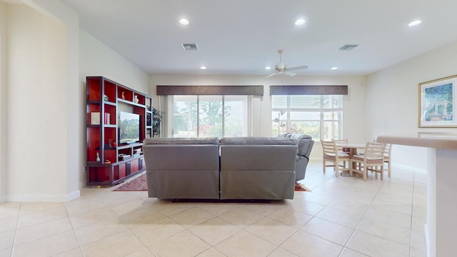 living room with recessed lighting, light tile patterned flooring, ceiling fan, and visible vents