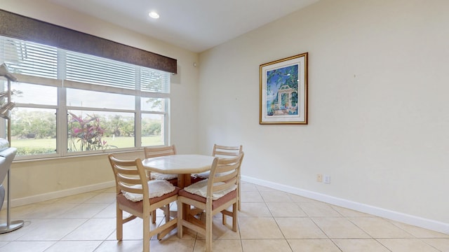 dining space featuring light tile patterned floors, recessed lighting, and baseboards