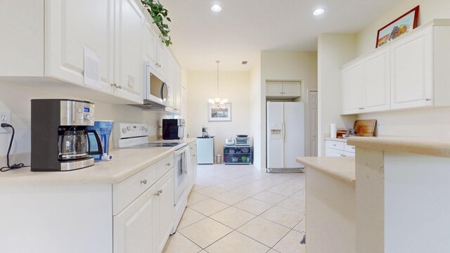 kitchen featuring light tile patterned floors, recessed lighting, light countertops, white cabinets, and white appliances