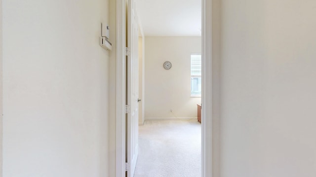 corridor with light colored carpet