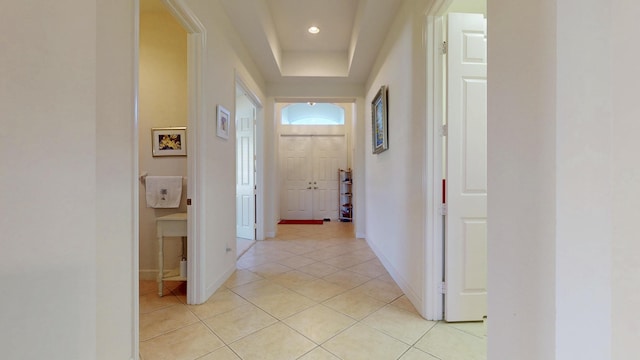 hall with light tile patterned floors, baseboards, and recessed lighting