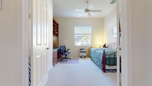 carpeted bedroom with baseboards, visible vents, and ceiling fan