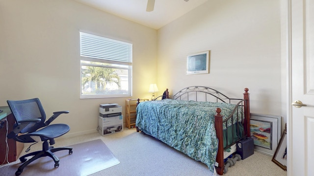 bedroom featuring carpet floors, baseboards, and a ceiling fan