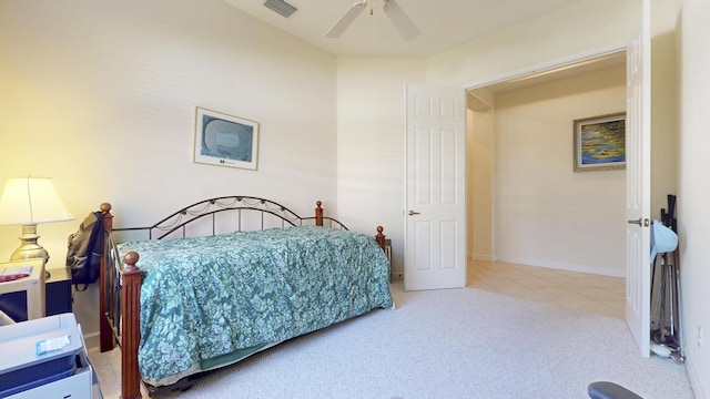 bedroom featuring ceiling fan, carpet flooring, visible vents, baseboards, and tile patterned floors